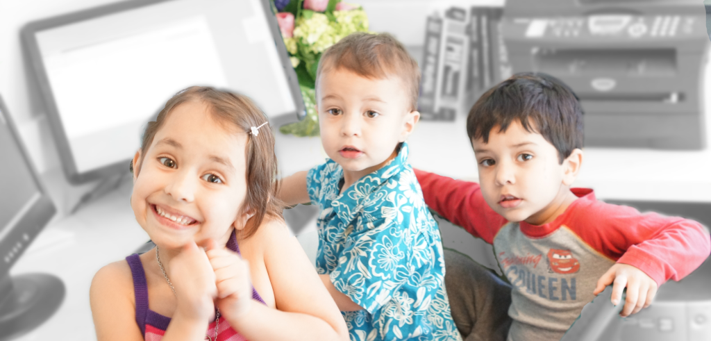 Stuart's three children playing at Daddy's computer