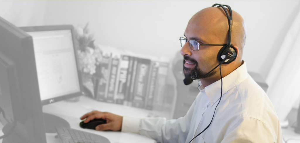 Stuart uses phone headset to provide tech support